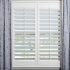 ShutterSMART composite shutters with blue textured drapery